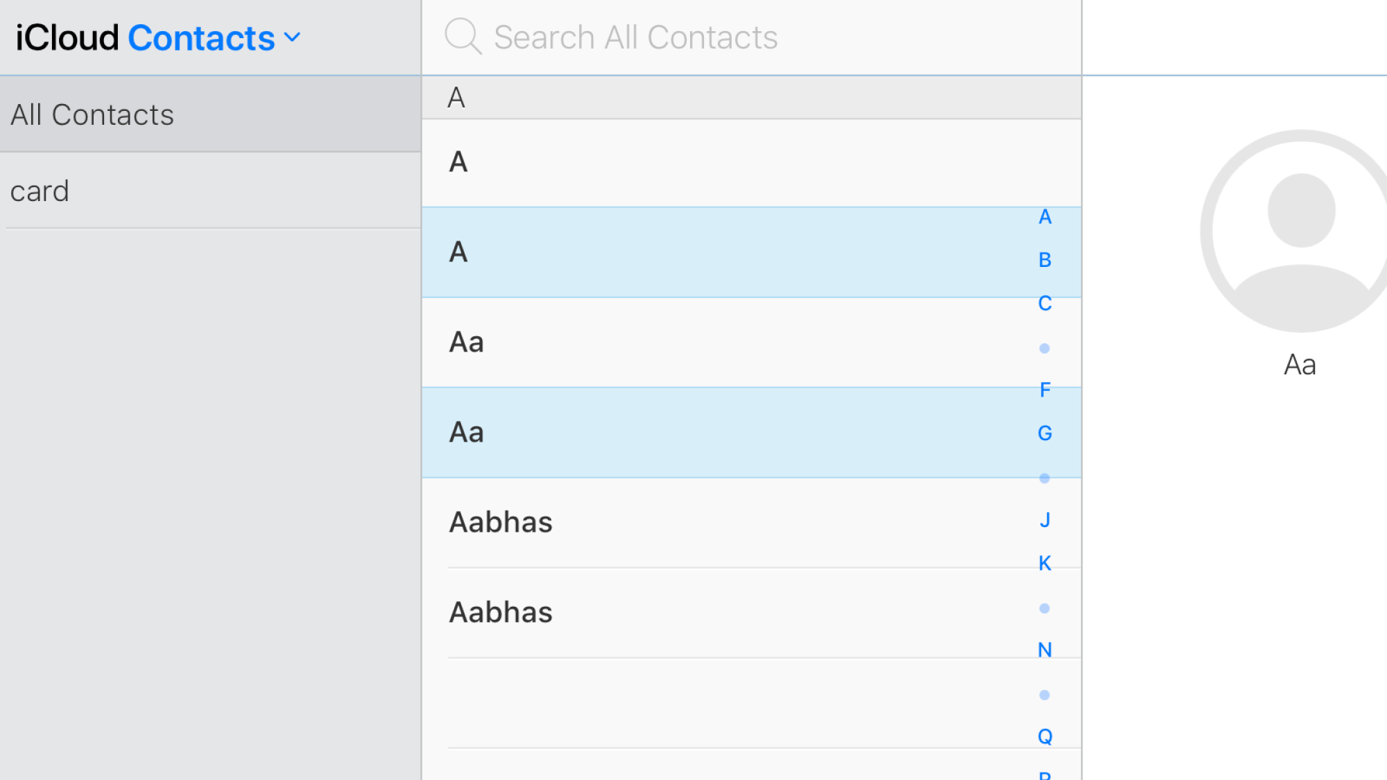 Manually selecting duplicate contacts on iCloud.com.